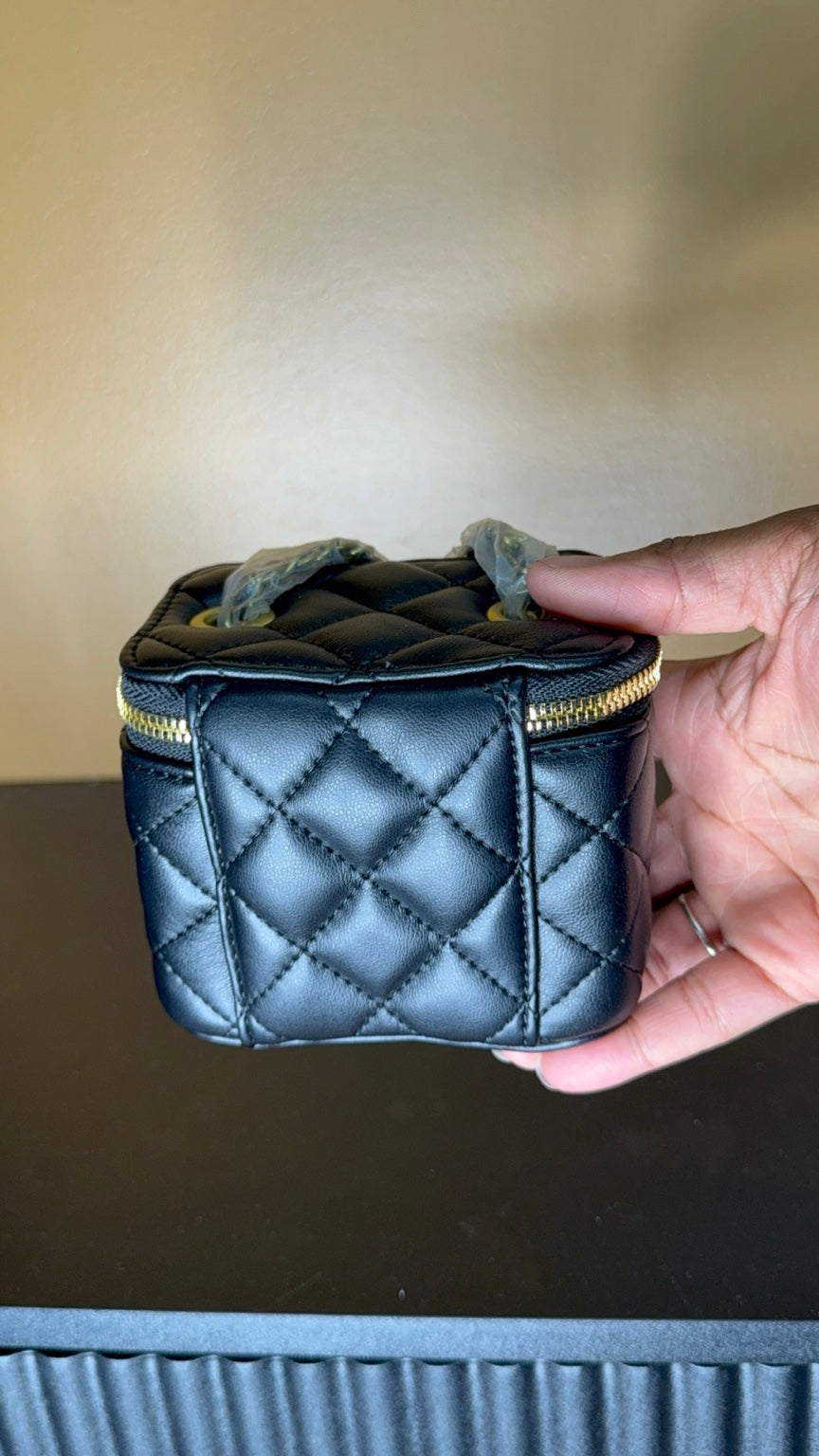 Black Chanel vanity bag side view