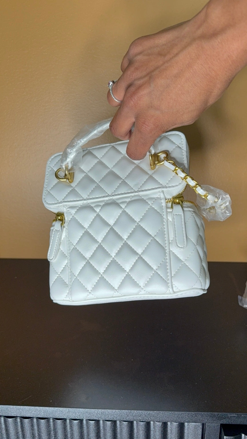 White Chanel vanity bag side view